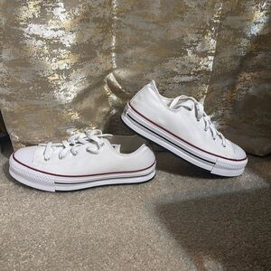 All white low top Converse